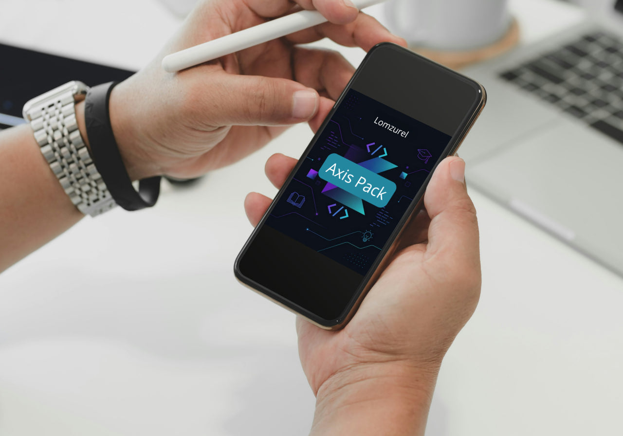 Person holding a smartphone with a software development interface on a blurred office background